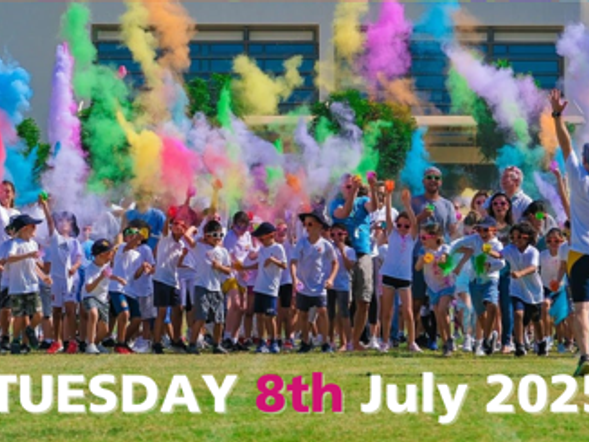 A group of young people setting off on a colour run with coloured smoke int he air