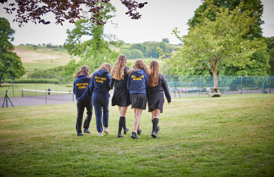 A group of female pupils are walking away