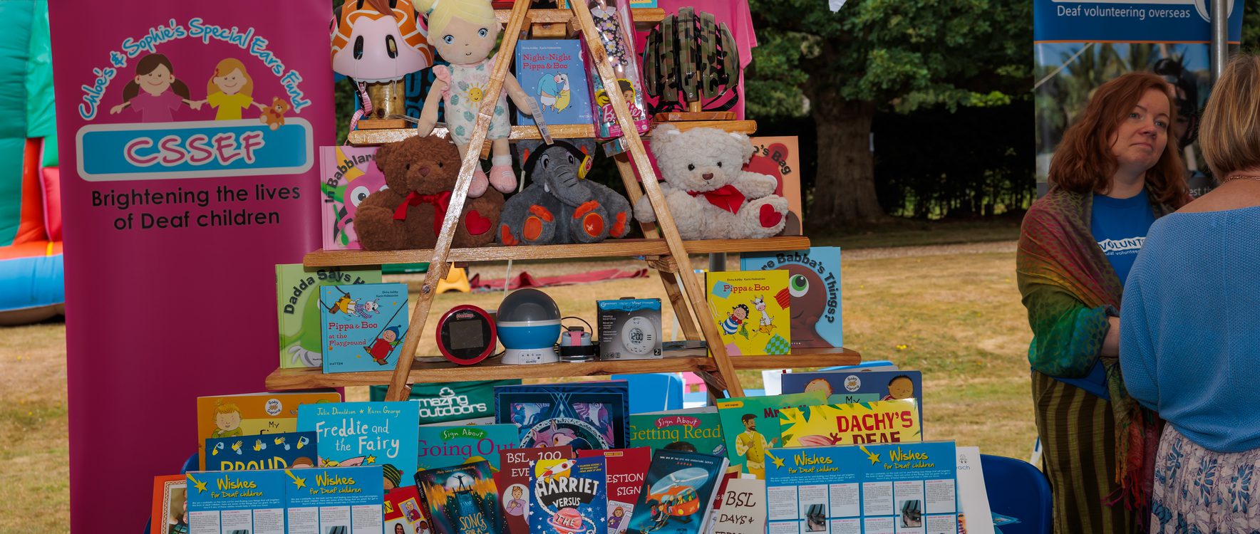 An impressive and decorative information stand with a number of toys and gifts suitable for children of the Deaf community.