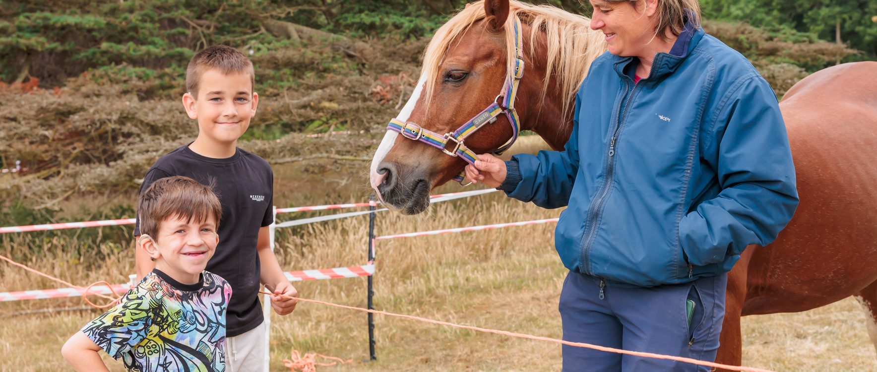 Children engaging with a pony