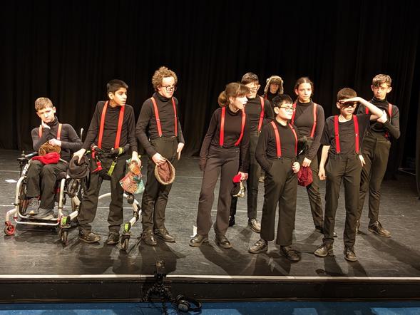 A group of students performing on a stage