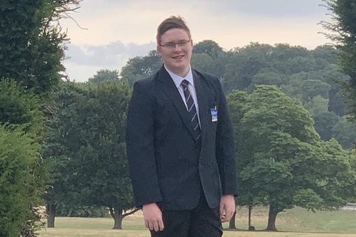 A smartly dressed young adult male.