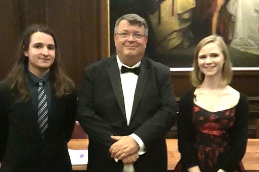 Principal Peter Gale is standing between Head Girl and Head Boy