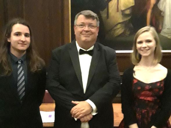 Principal Peter Gale is standing between Head Girl and Head Boy