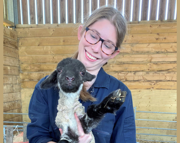Neve Massey holding a lamb
